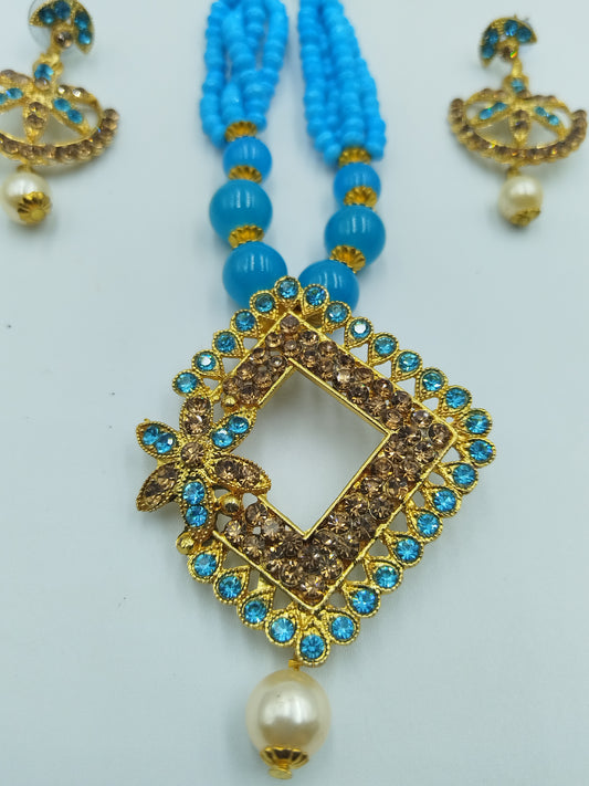 BEAUTIFUL BABY BLUE  AND GOLD NECKLACE AND EARRING SET
